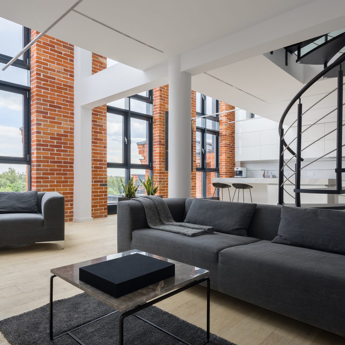 Living room in loft with big windows