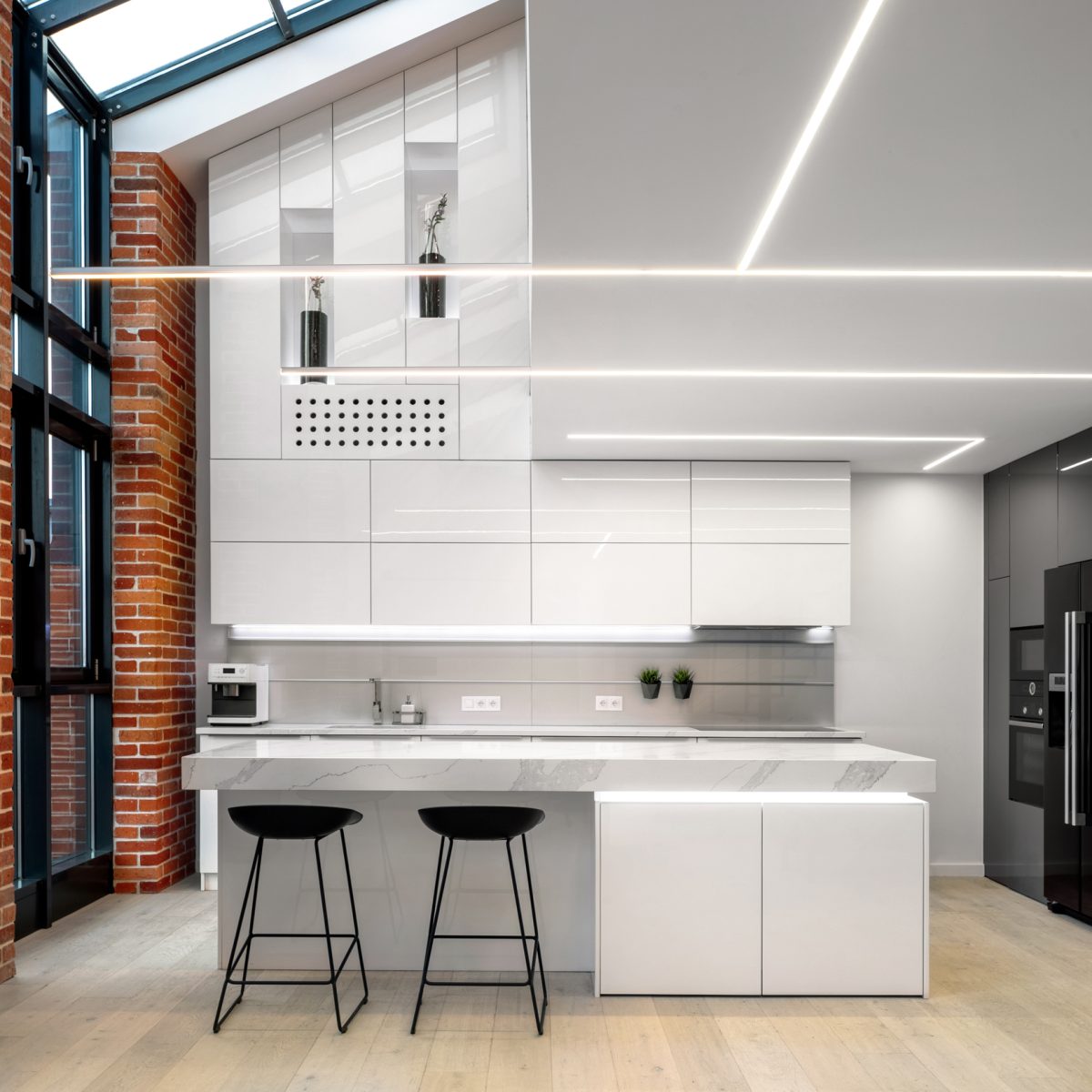 Elegant kitchen with brick wall