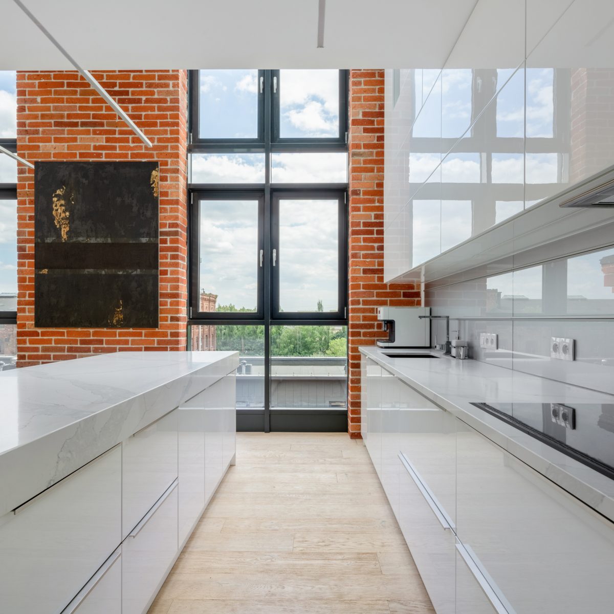 Kitchen in loft apartment with big windows