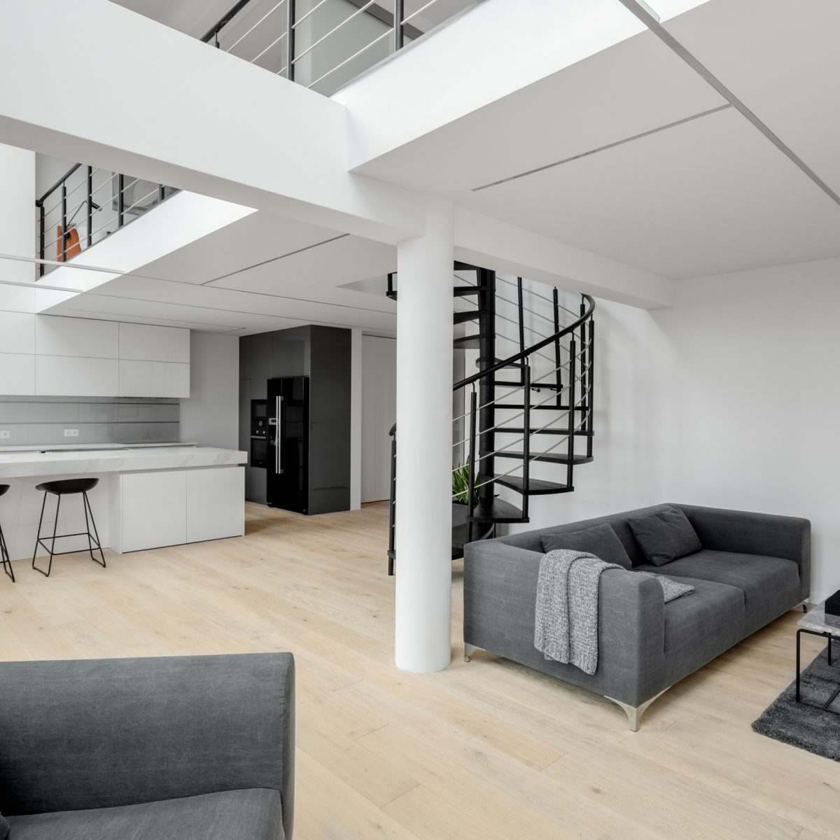 White apartment with mezzanine and stairs