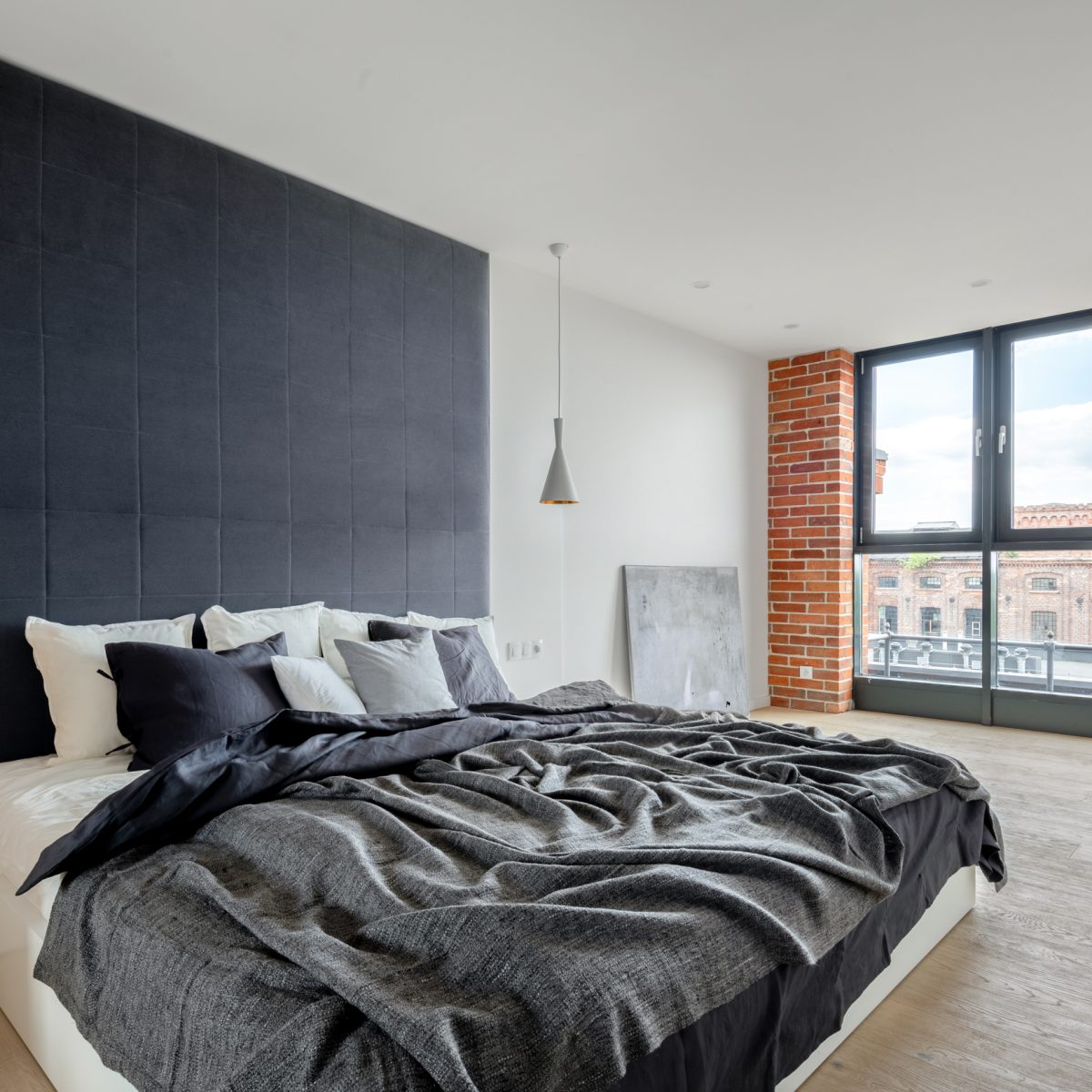 Bedroom with industrial style wall