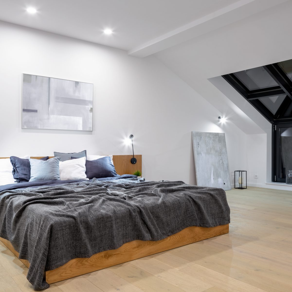 Big wooden bed in bedroom